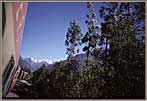 Switchback Train And Snow Capped Peaks