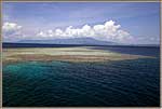 PNG Coral Reef With Volcano In Background