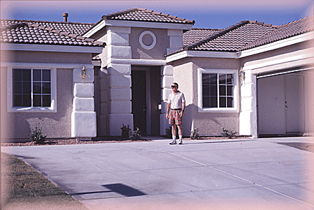 Out front his new dream home.
