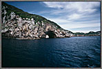 Cabin Cruiser Through Huge Arch