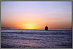 Grounded Freighter Against Sunset